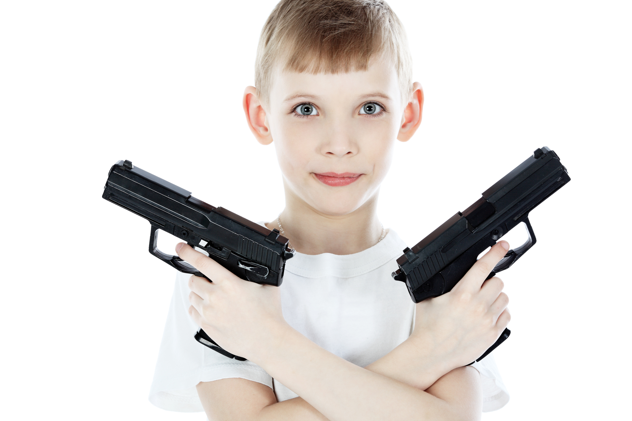 image of a child holding 2 toy guns