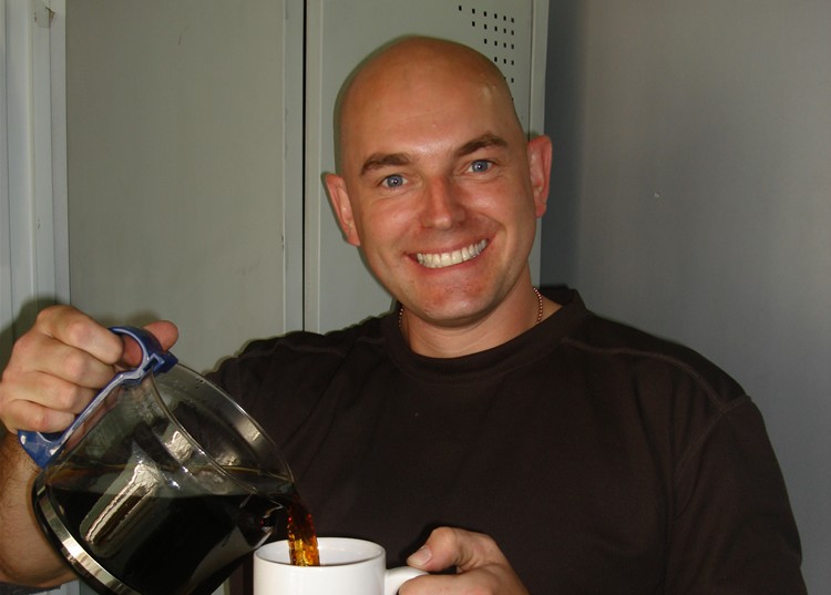 An image of me pouring a cup of coffee whilst on operation tour in Afghanistan