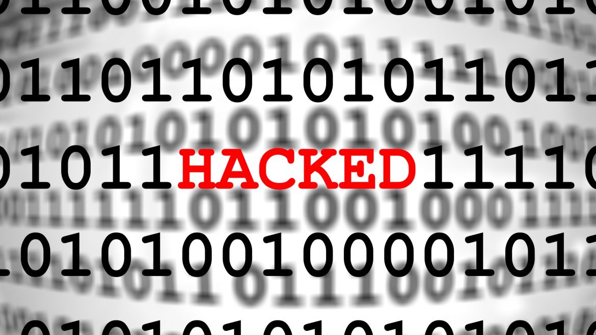 binary text with the word 'hacked' super-imposed over it